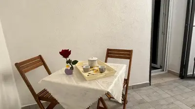a table with a tray of food and flowers on it at Cuba Holiday House in Palermo