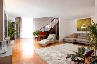 a living room with a couch and a table at Behind the Cathedral apt in Palermo