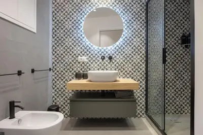 a bathroom with a sink and a mirror at Roccella Apartments in Palermo
