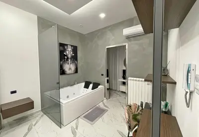 a bathroom with a bath tub and a sink at Suite del Principe - Prince's Suite. in Palermo