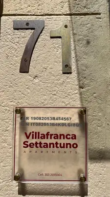 a sign on the side of a building with at Villafranca settantuno Apartments in Palermo