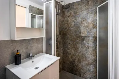 a bathroom with a sink and a shower at Villafranca settantuno Apartments in Palermo