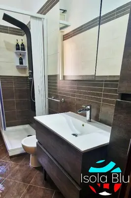 a bathroom with a sink and a toilet at Isola Blu Casa a pochi passi dal mare in Isola delle Femmine