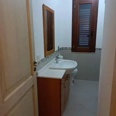 a bathroom with a sink and a mirror at Casa vacanza Acquanuova in Calatafimi