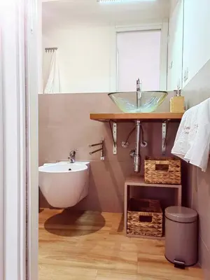 a bathroom with a sink and a bath tub at N&L Apartments Palermo in Palermo