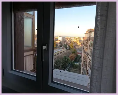 an open window with a view of a city at Kalos in Palermo