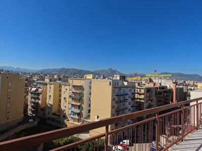 a view of a city from a balcony at Kalos in Palermo