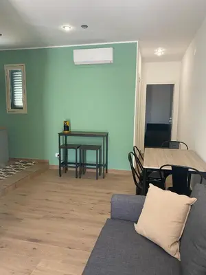 a living room with a couch and a table at Mondello Twentytwo House in Palermo