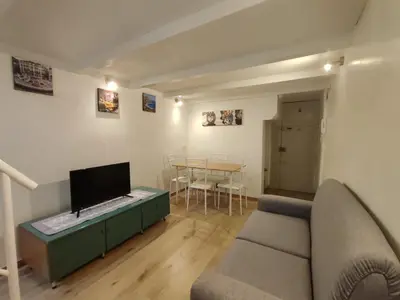 a living room with a couch and a table at Casa di Tommy in Palermo