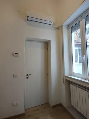 an empty room with a door and a window at Casa di Tommy in Palermo