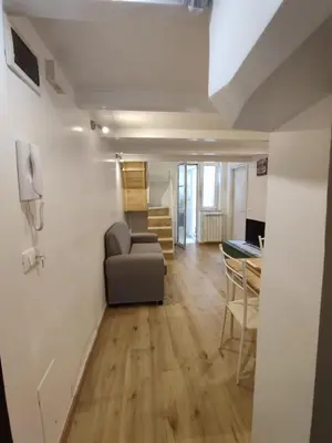 a living room with a couch and a table at Casa di Tommy in Palermo