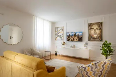 a living room with a couch and a table at Palace Ducrot in Palermo