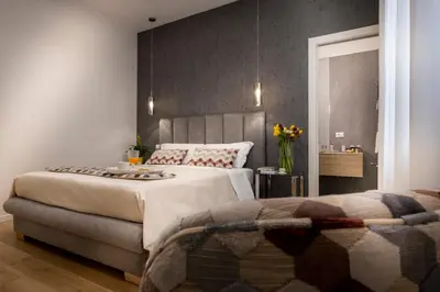 a bedroom with a large bed in a room at Ducrot Apartment in Palermo