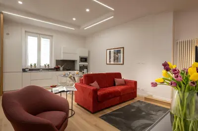 a living room with two chairs and a table at Ducrot Apartment in Palermo