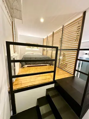 a room with two bunk beds and a staircase at Cala Peppa Loft Butera in Palermo
