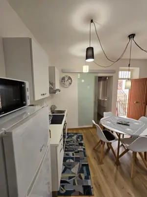 a kitchen with a table and a dining room at Virginia House1 in Palermo