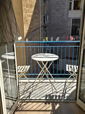 a balcony with a table and chairs and a pool at Virginia House1 in Palermo