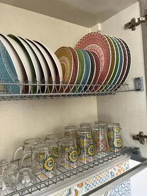 a bunch of plates and bowls on a shelf at Le Terrazze di Chiara in Palermo