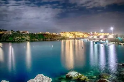 a large body of water at night with lights at Casa di Pippo in Trappeto