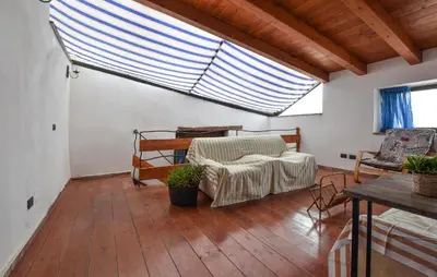 a living room with a couch and a large window at Amazing Home In Trappeto With Wifi in Trappeto