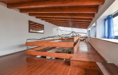 a bedroom with a bed and a wooden floor at Amazing Home In Trappeto With Wifi in Trappeto
