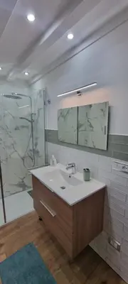 a bathroom with a sink and a shower at Le Antiche Porte in Palermo