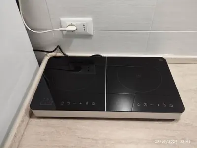a dvd player plugged into a wall outlet at La casa di Nanà IL BAGLIO in Palermo