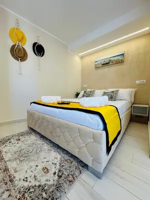 a bedroom with a bed with a mirror and a dresser at Gioiamia Luxury Apartment in Palermo