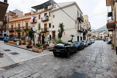a city street with cars parked on the street at Ciao Sycylia Apartments in Carini