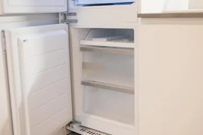 a refrigerator with its door open in a kitchen at La casa di Louis in Palermo