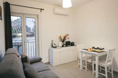 a living room with a couch and a table at La casa di Louis in Palermo