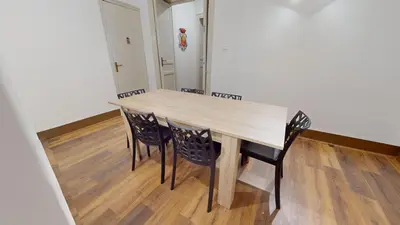 a dining room table and chairs in a room at Ai Crociferi affittacamere in Palermo