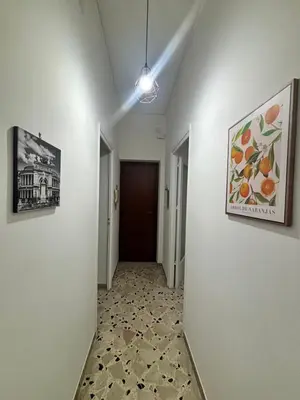 an empty hallway with a hallwayngthngthngthngthngthngthngthngthngthngth at Licia's home in Palermo
