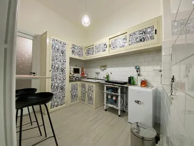 a kitchen with a white refrigerator and a counter at Licia's home in Palermo