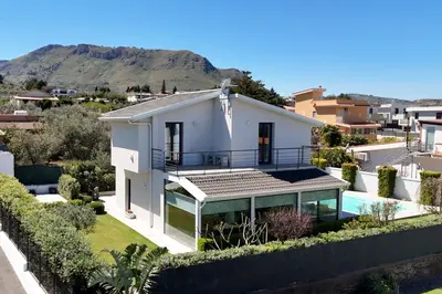 a house with a swimming pool and a villa at Luxury villa Taravilla with pool in Altavilla Milicia
