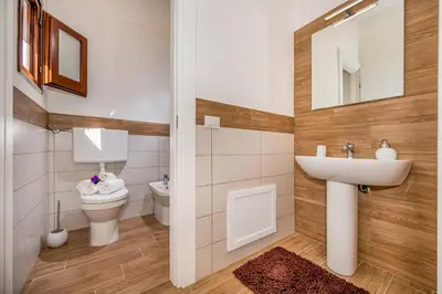 a bathroom with a sink and a toilet at Casa Del Golfo SantAntonino in Castellammare del Golfo