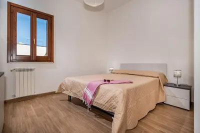 a bedroom with a bed and a window at Casa Del Golfo SantAntonino in Castellammare del Golfo