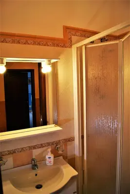 a bathroom with a sink and a mirror at la Maison 