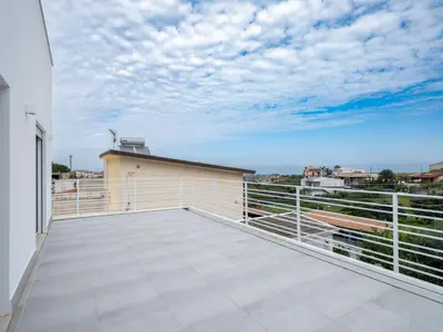 a balcony with a view of the sky at Villa Timpi Rossi Total Relax in Alcamo