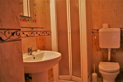 a bathroom with a sink and a toilet at B&B Oleaster - Bolognetta in Bolognetta