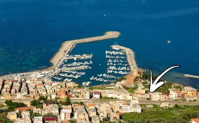 an aerial view of a harbor with boats in the water at L'Arco Verde San Nicola l'Arena in Trabia