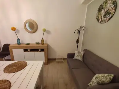 a living room with a couch and a table at L'Arco Verde San Nicola l'Arena in Trabia
