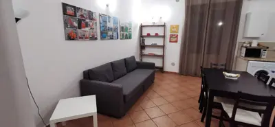 a living room with a couch and a table at Casa Bellini in Palermo
