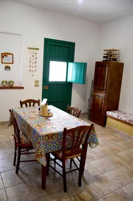a couch sitting in the corner of a room at Da Silvia, a due passi dal mare in San Vito lo Capo