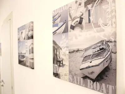a picture of a boat hanging on a wall at A CASA DI IDA in Palermo