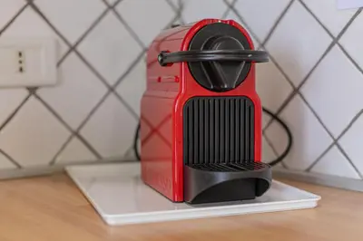 a red mixer sitting on top of a counter at Villa Le Terrazze in Cefalù