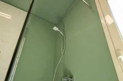 a shower with a shower head in a bathroom at Villa Le Terrazze in Cefalù