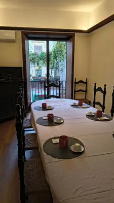 a plate of croissants sitting on a red table at Palazzo del Bono suites in Palermo