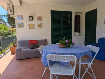 a table with a blue table cloth on a patio at Rosalba apartments - cheap and characteristic in Palermo