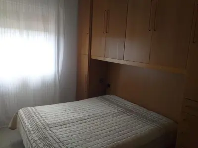 a small bedroom with a bed and a window at Rosalba apartments - cheap and characteristic in Palermo